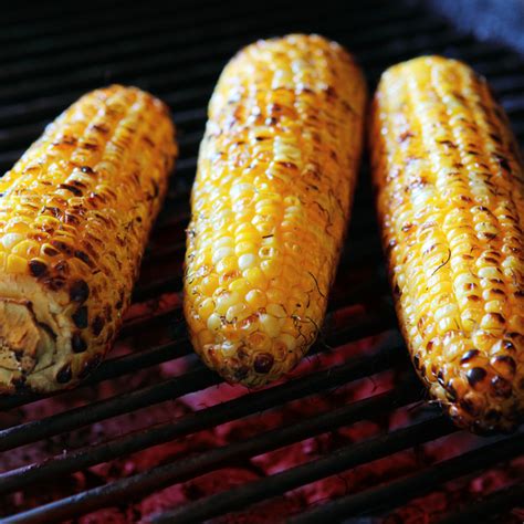 cooking husked corn on grill